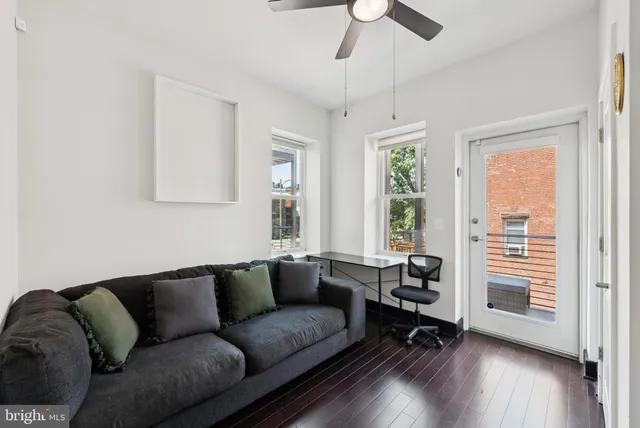 a living room with furniture and a window