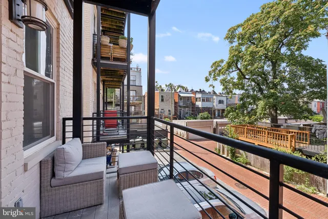a view of a balcony with furniture