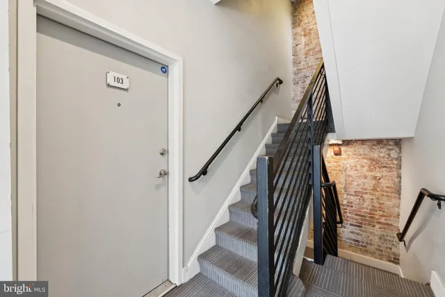 a view of entryway with wooden floor