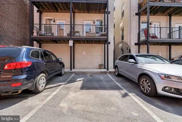 a view of a car parked in front of a house