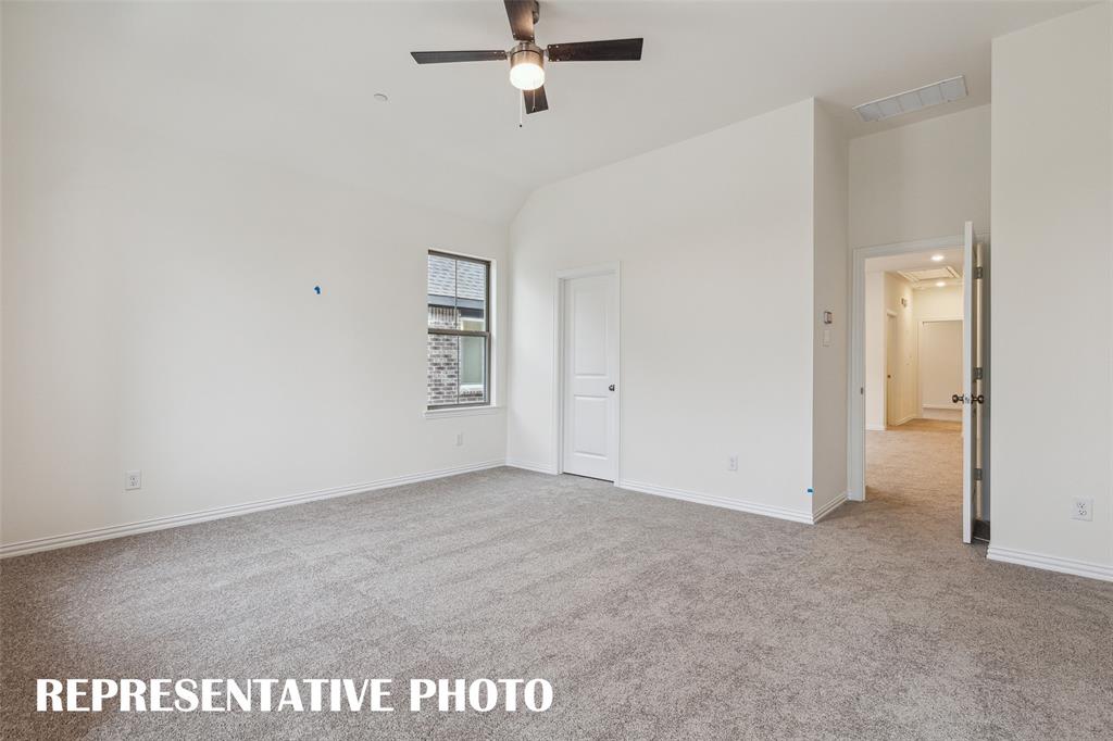 226 Dylan Way Midlothian, TX 76065 - Photo 14 of 15 A spacious owner's suite that offers high ceilings, natural light from multiple windows, his & hers walk in closets....our Hansen floor plan has it all! REPRESENTATIVE PHOTO