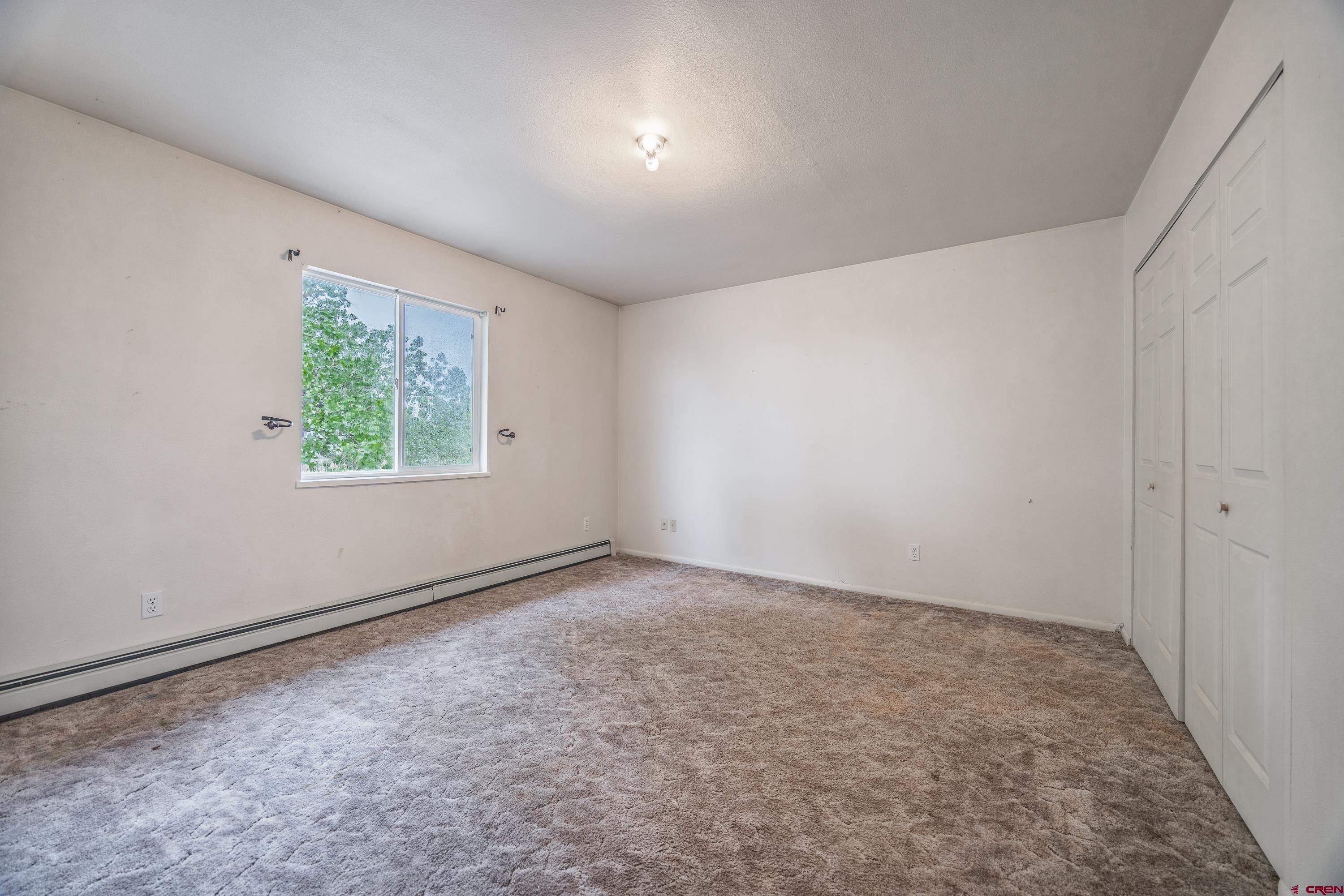 17377 Breeze Road Delta, CO 81416 - Photo 11 of 45 an empty room with windows