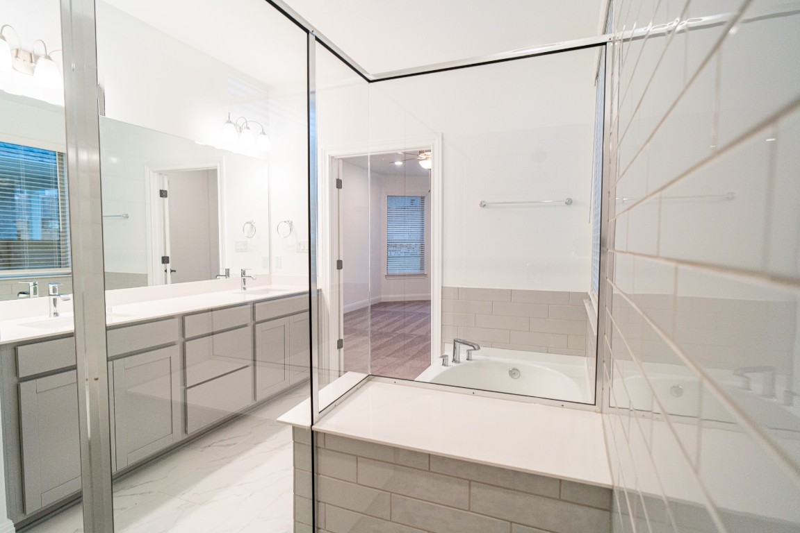 3501 Jaulan Street Leander, TX 78641 - Photo 20 of 22 a bathroom with a sink and a shower