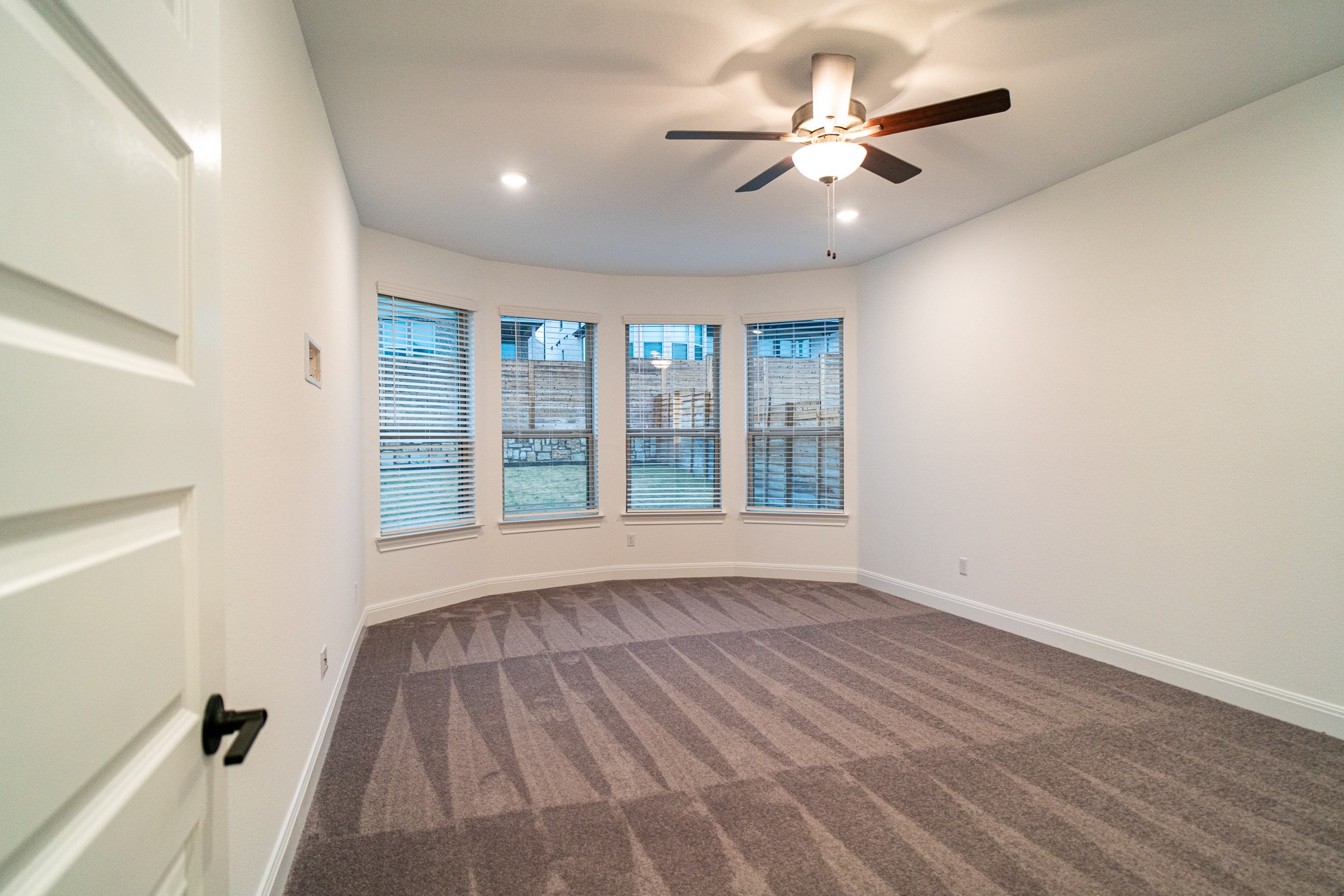 3501 Jaulan Street Leander, TX 78641 - Photo 20 of 33 Spare room with dark colored carpet, a ceiling fan, and recessed lighting