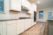 3501 Jaulan Street Leander, TX 78641 - Photo 7 of 22 a kitchen with granite countertop white cabinets and white appliances