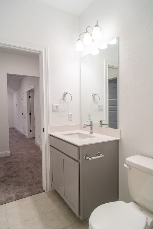 3501 Jaulan Street Leander, TX 78641 - Photo 9 of 22 a bathroom with a toilet a sink and mirror