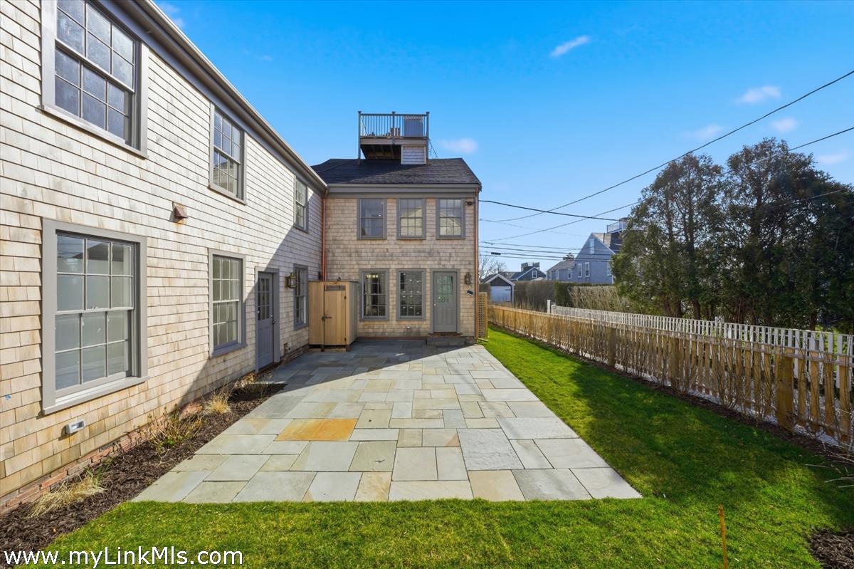 85 Orange Street Nantucket, MA 02554 - Photo 10 of 89 a view of a house with a yard