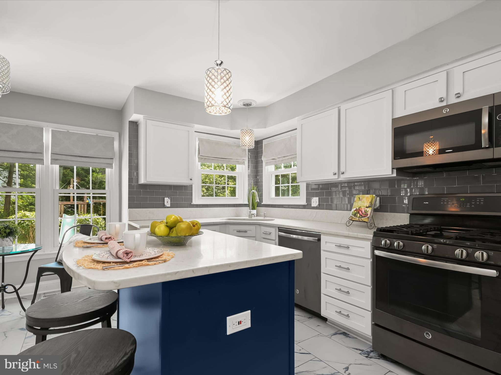 307 Carriage Run Road Annapolis, MD 21403 - Photo 13 of 52 a kitchen with a stove a sink and a microwave