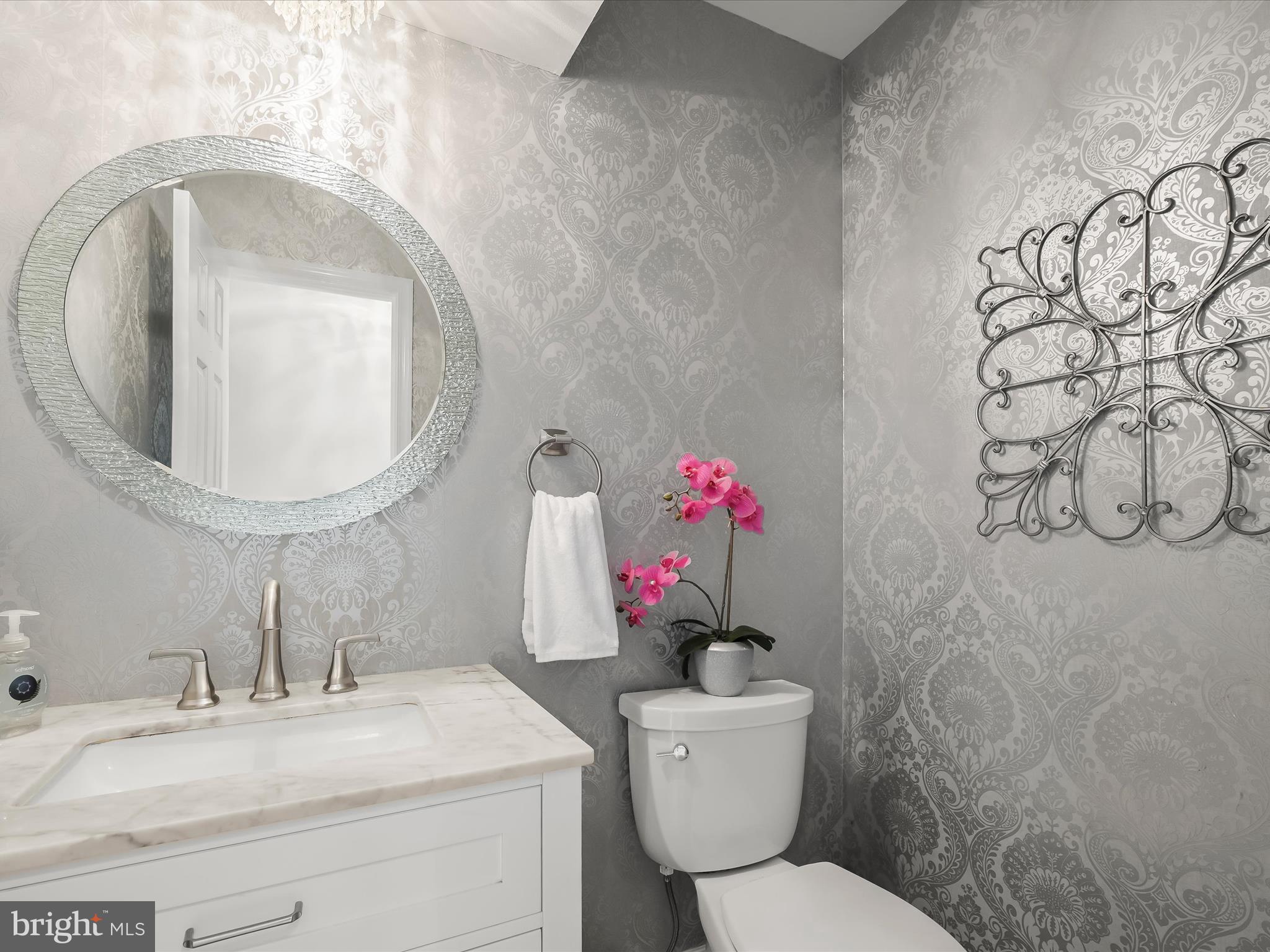 307 Carriage Run Road Annapolis, MD 21403 - Photo 19 of 52 a bathroom with a toilet sink vanity and mirror