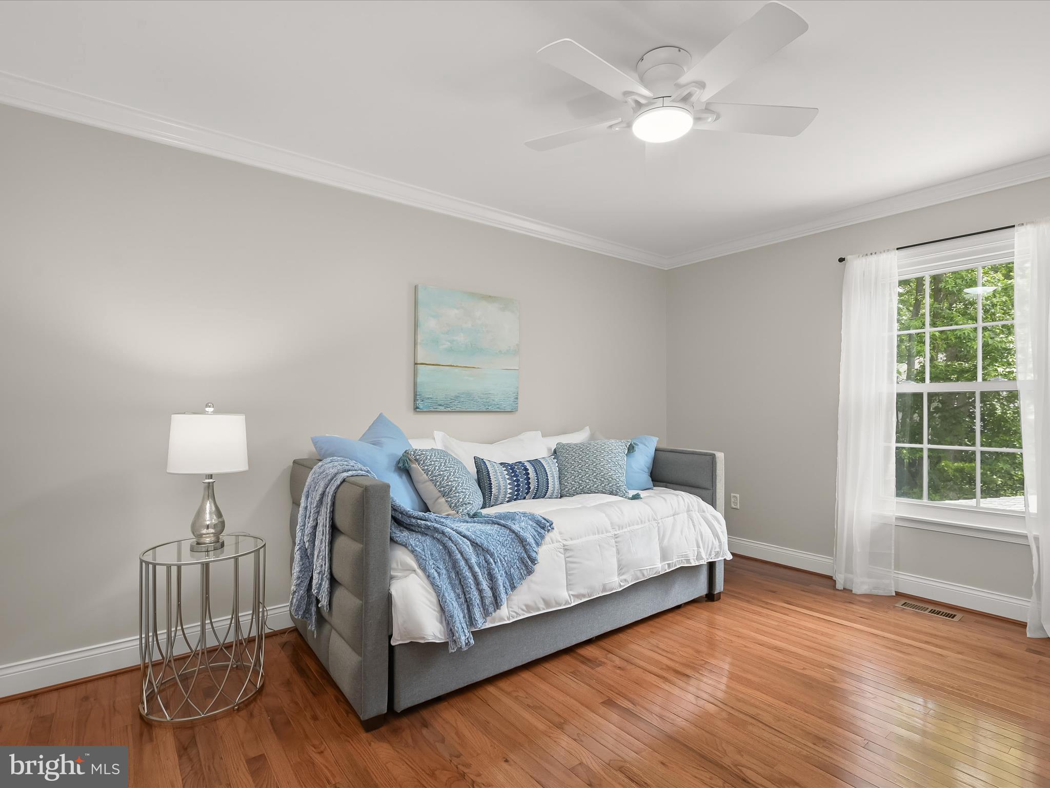 307 Carriage Run Road Annapolis, MD 21403 - Photo 34 of 52 a large bedroom with a bed and wooden floor