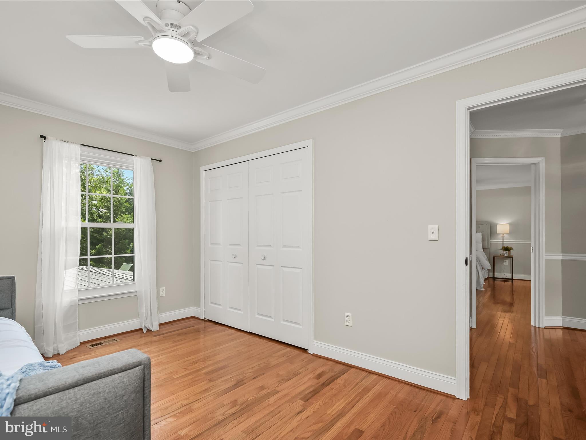 307 Carriage Run Road Annapolis, MD 21403 - Photo 35 of 52 an empty room with wooden floor and windows