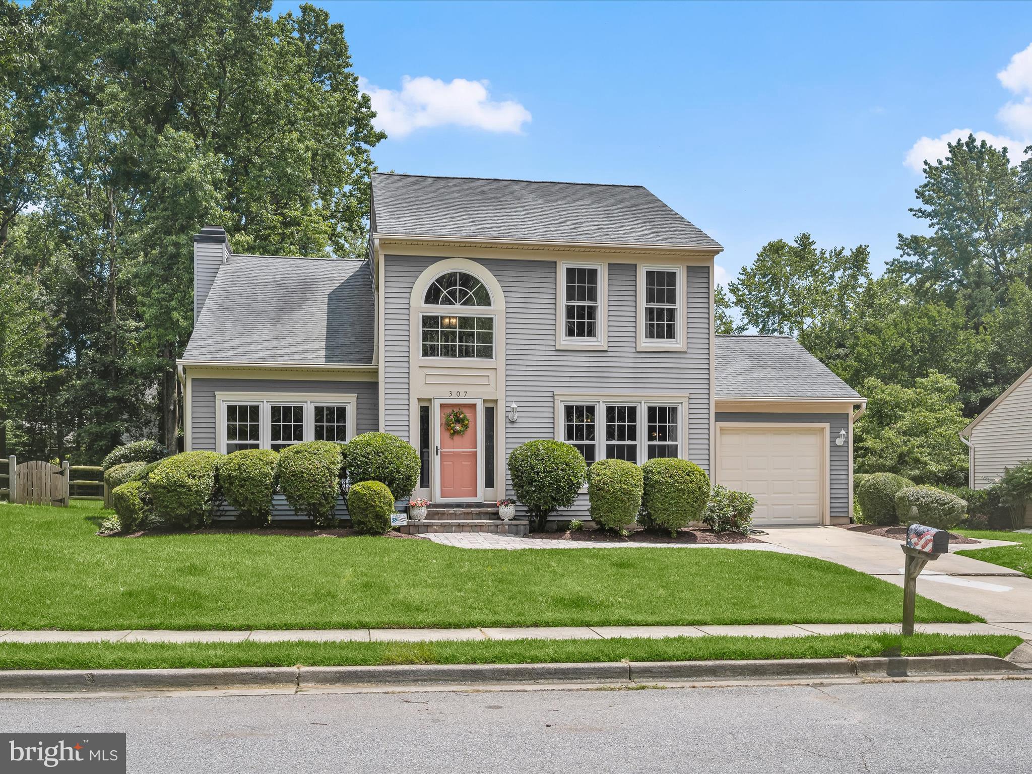 307 Carriage Run Road Annapolis, MD 21403 - Photo 44 of 52 a front view of a house with a garden and plants