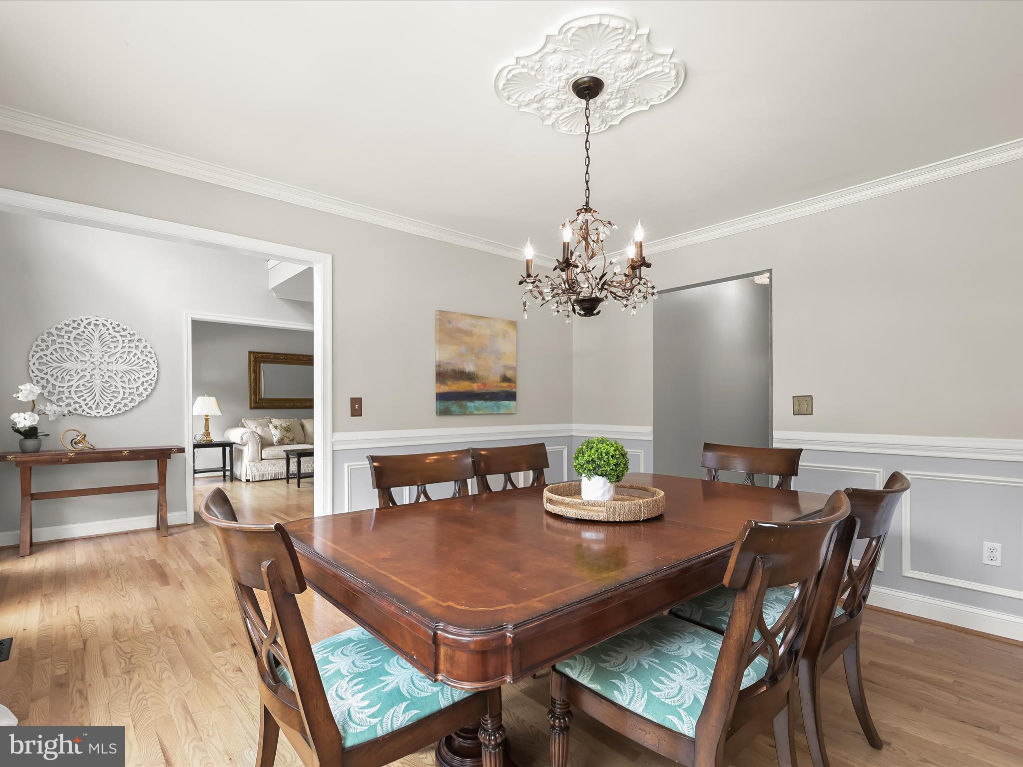 307 Carriage Run Road Annapolis, MD 21403 - Photo 8 of 52 a view of a dining room with furniture a chandelier and wooden floor