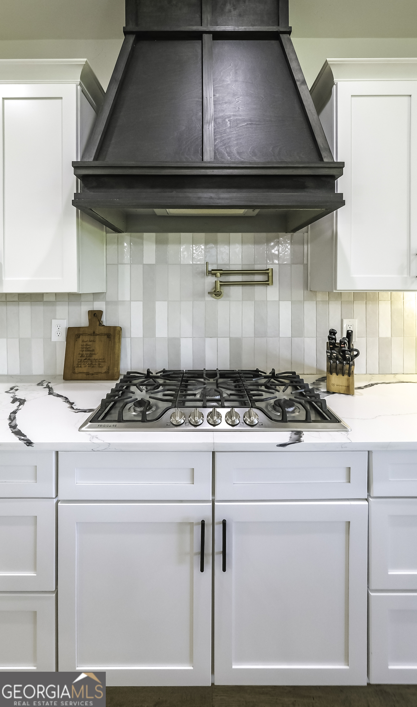 2392 Welcome Road Roopville, GA 30170 - Photo 8 of 43 a stove top oven sitting inside of a kitchen