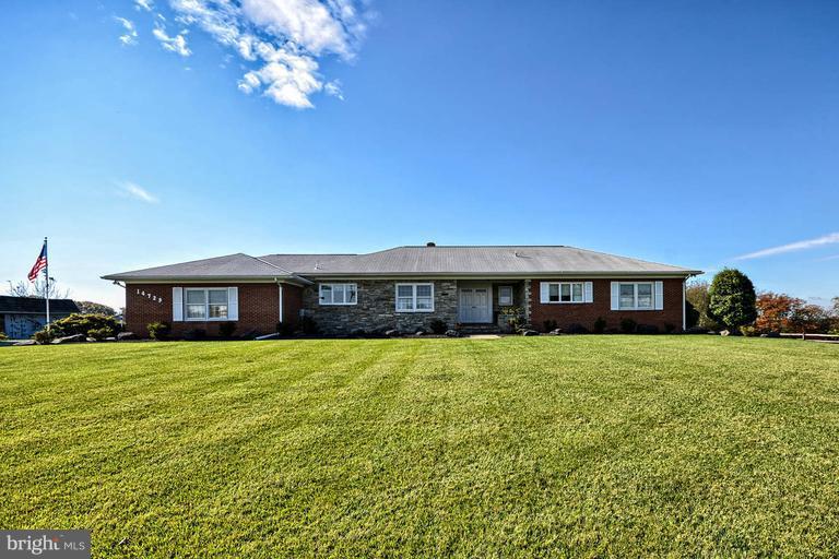 14729 Shirley Bohn Road Mount Airy, MD 21771 - Photo 1 of 21 a view of a house with a big yard
