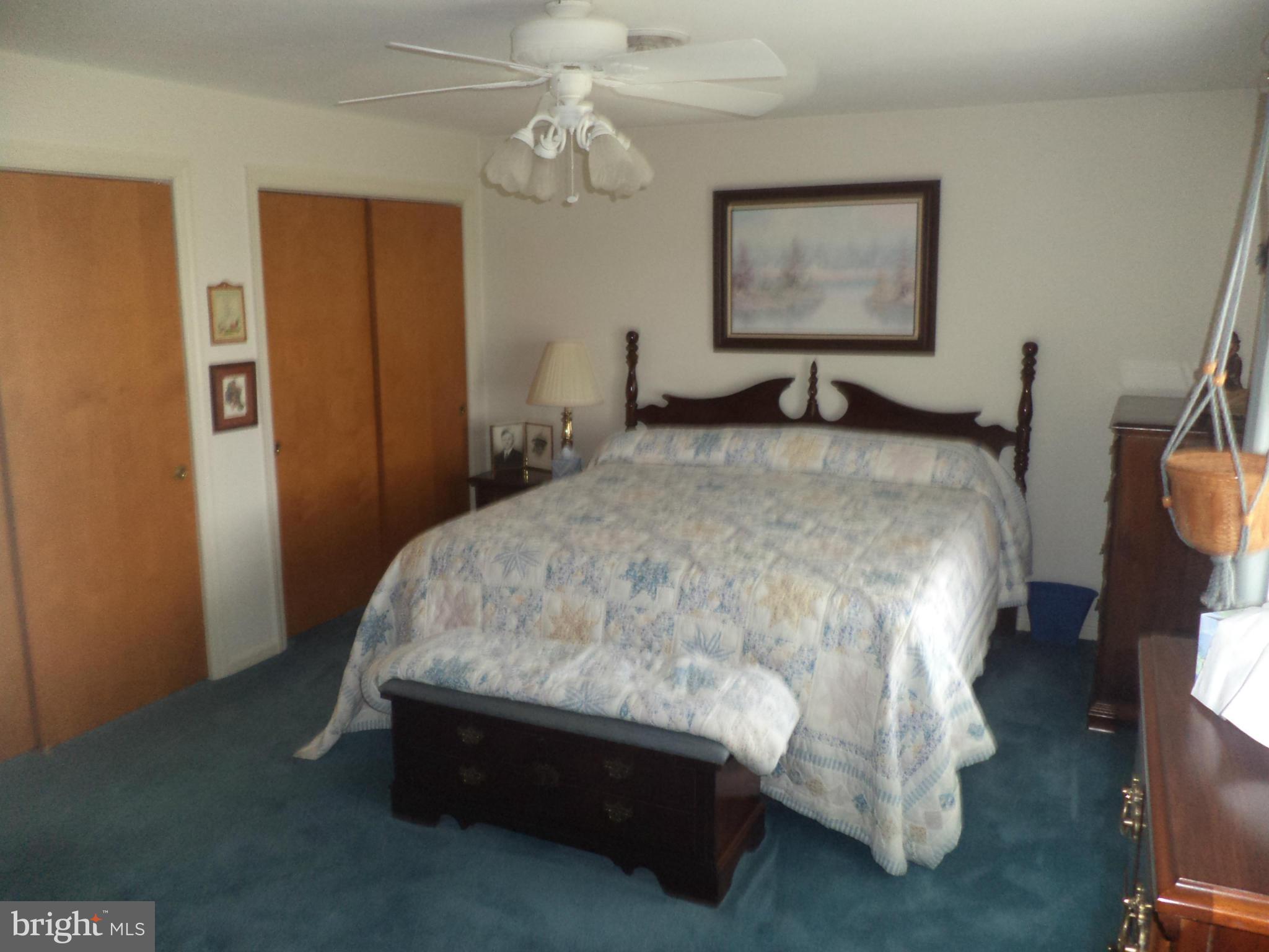 14729 Shirley Bohn Road Mount Airy, MD 21771 - Photo 2 of 21 a bed sitting in a spacious bedroom next to a window