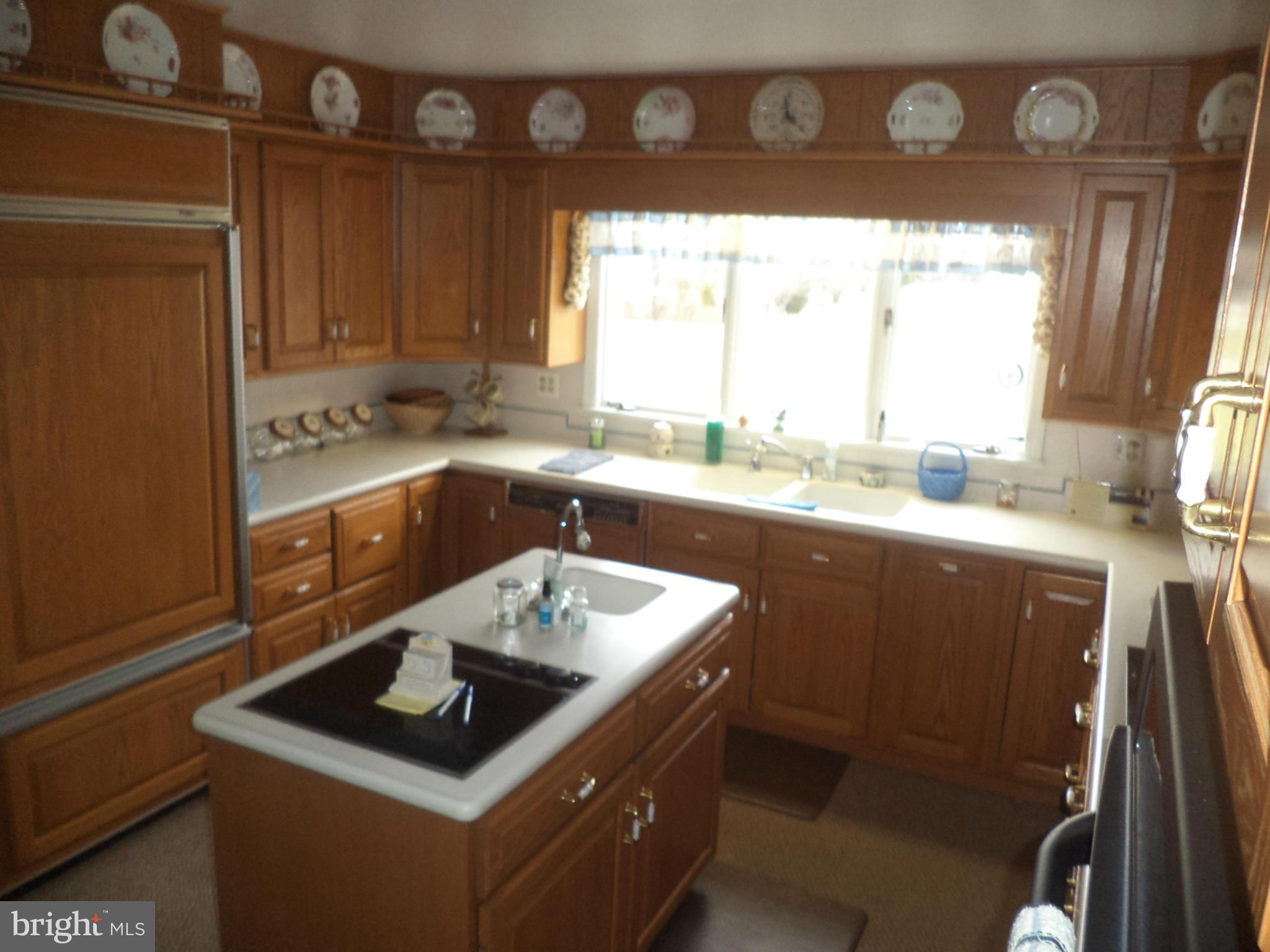 14729 Shirley Bohn Road Mount Airy, MD 21771 - Photo 6 of 21 a kitchen with a sink stove and cabinets