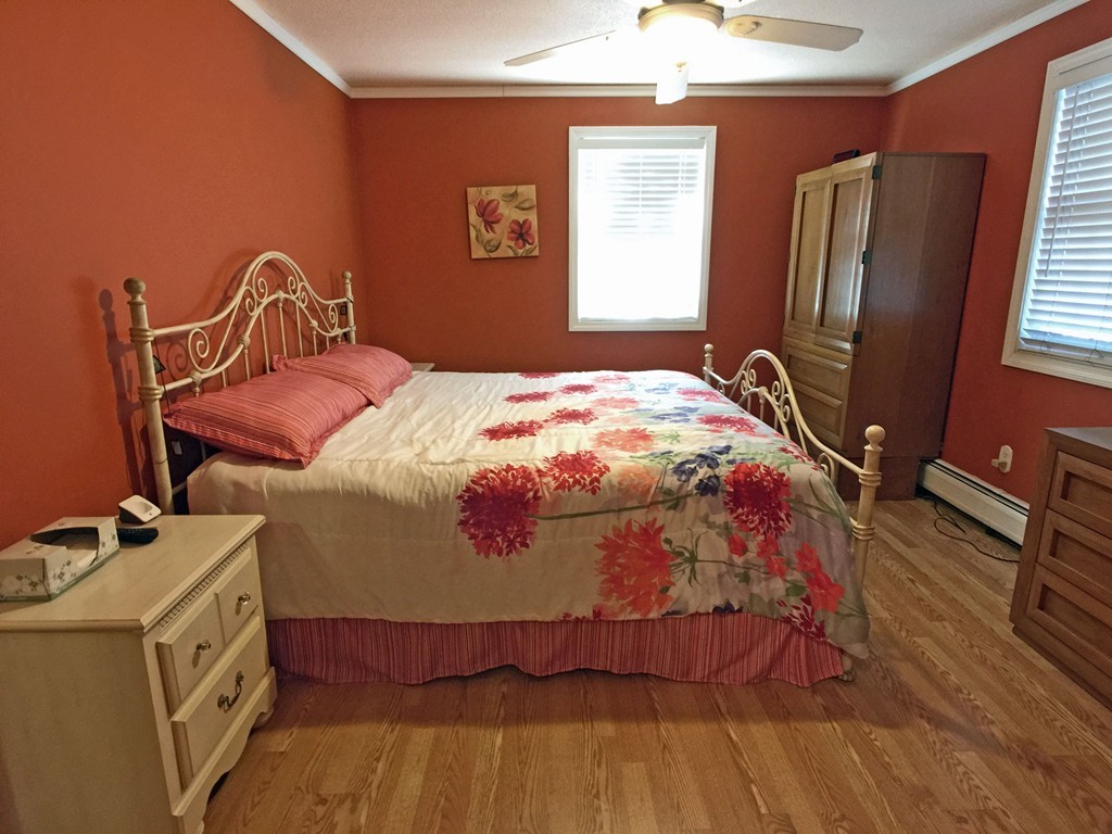 353 Renaud Street Fall River, MA 02721 - Photo 16 of 21 a bedroom with a bed and wooden floor