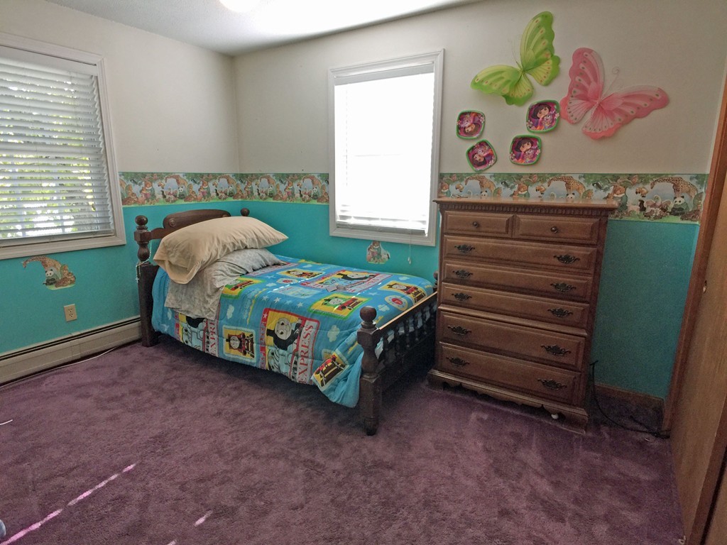 353 Renaud Street Fall River, MA 02721 - Photo 17 of 21 a bedroom with a bed and a window