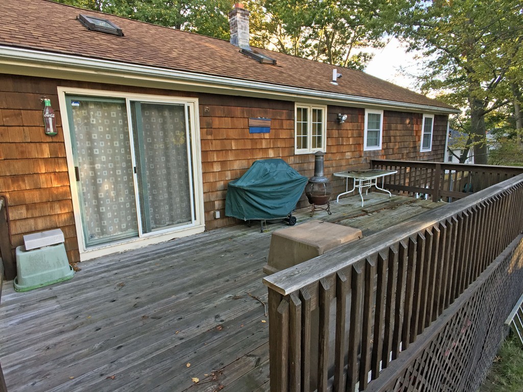353 Renaud Street Fall River, MA 02721 - Photo 3 of 21 a balcony with table and chairs