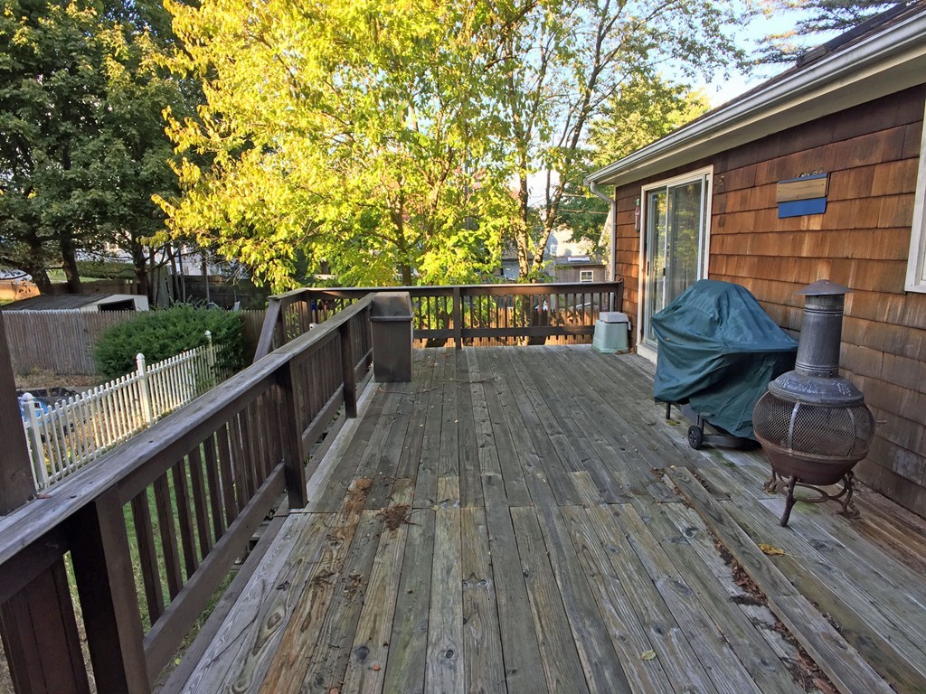 353 Renaud Street Fall River, MA 02721 - Photo 4 of 21 a view of deck with furniture and trees