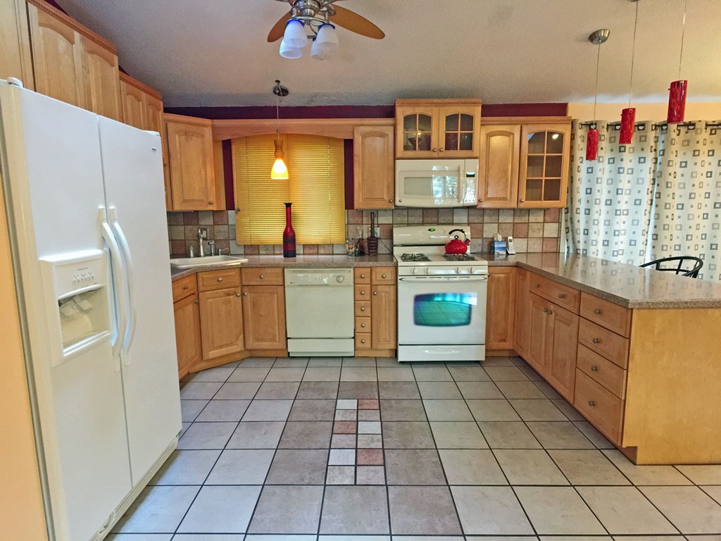 353 Renaud Street Fall River, MA 02721 - Photo 6 of 21 a kitchen with stainless steel appliances a stove refrigerator sink and microwave