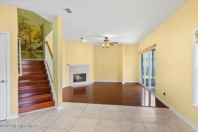 a view of a house with a yard patio and fire pit