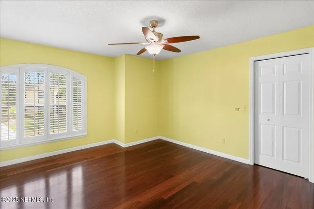 a aerial view of a house with a yard and a garage