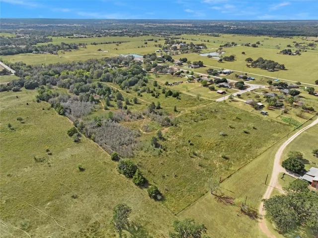 a view of a big yard with an outdoor space