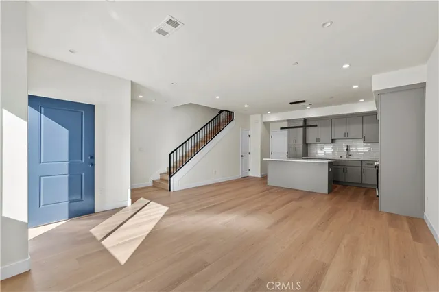 a view of a kitchen with sink and cabinet