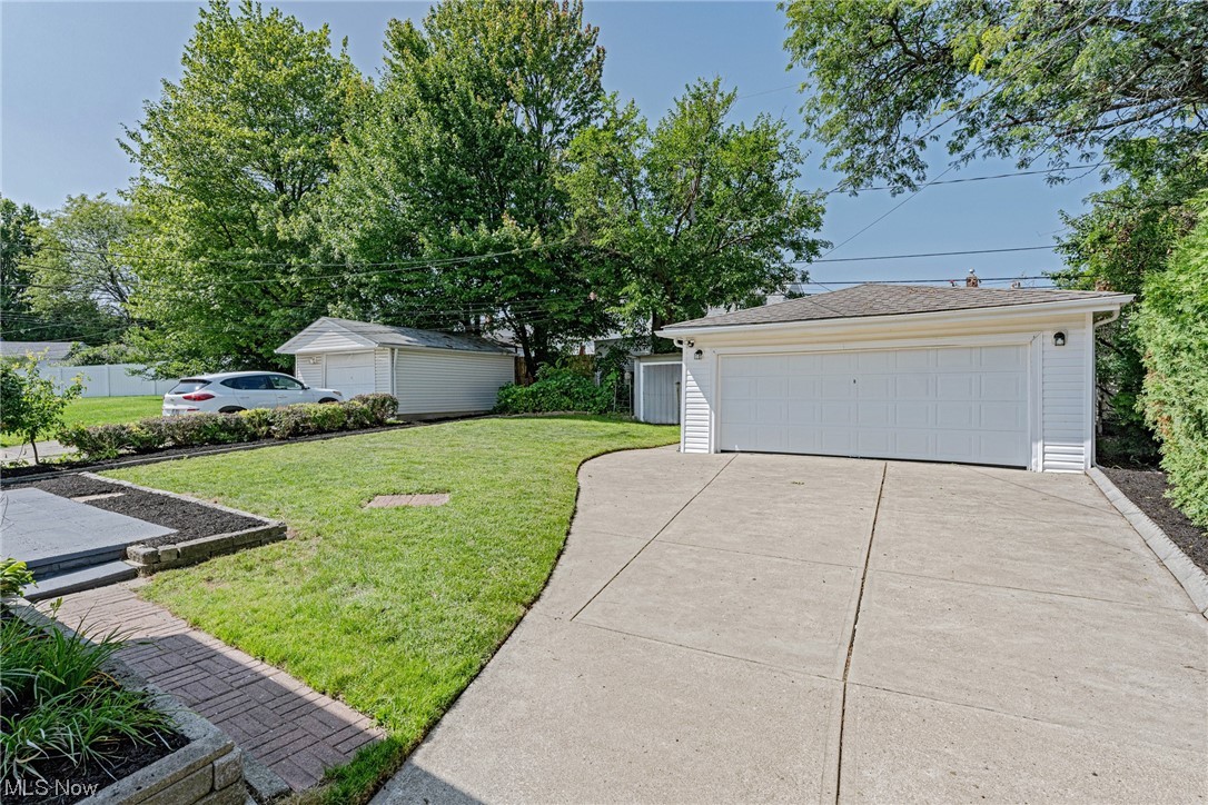 11815 Derby Road Garfield Heights, OH 44125 - Photo 26 of 31 View of yard featuring garage