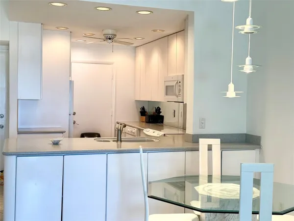 a bathroom with a double vanity sink a mirror and shower