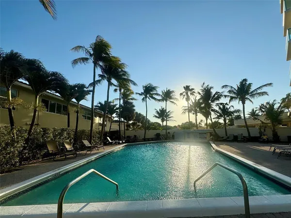 a view of a swimming pool with a garden