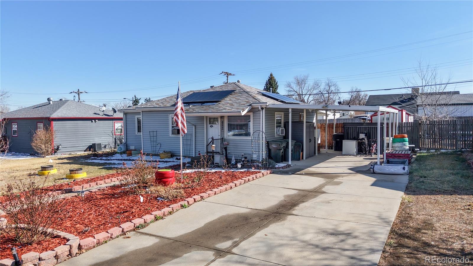 1960 Rowena Street Thornton, CO 80229 - Photo 2 of 48 a view of a house with swimming pool and sitting area