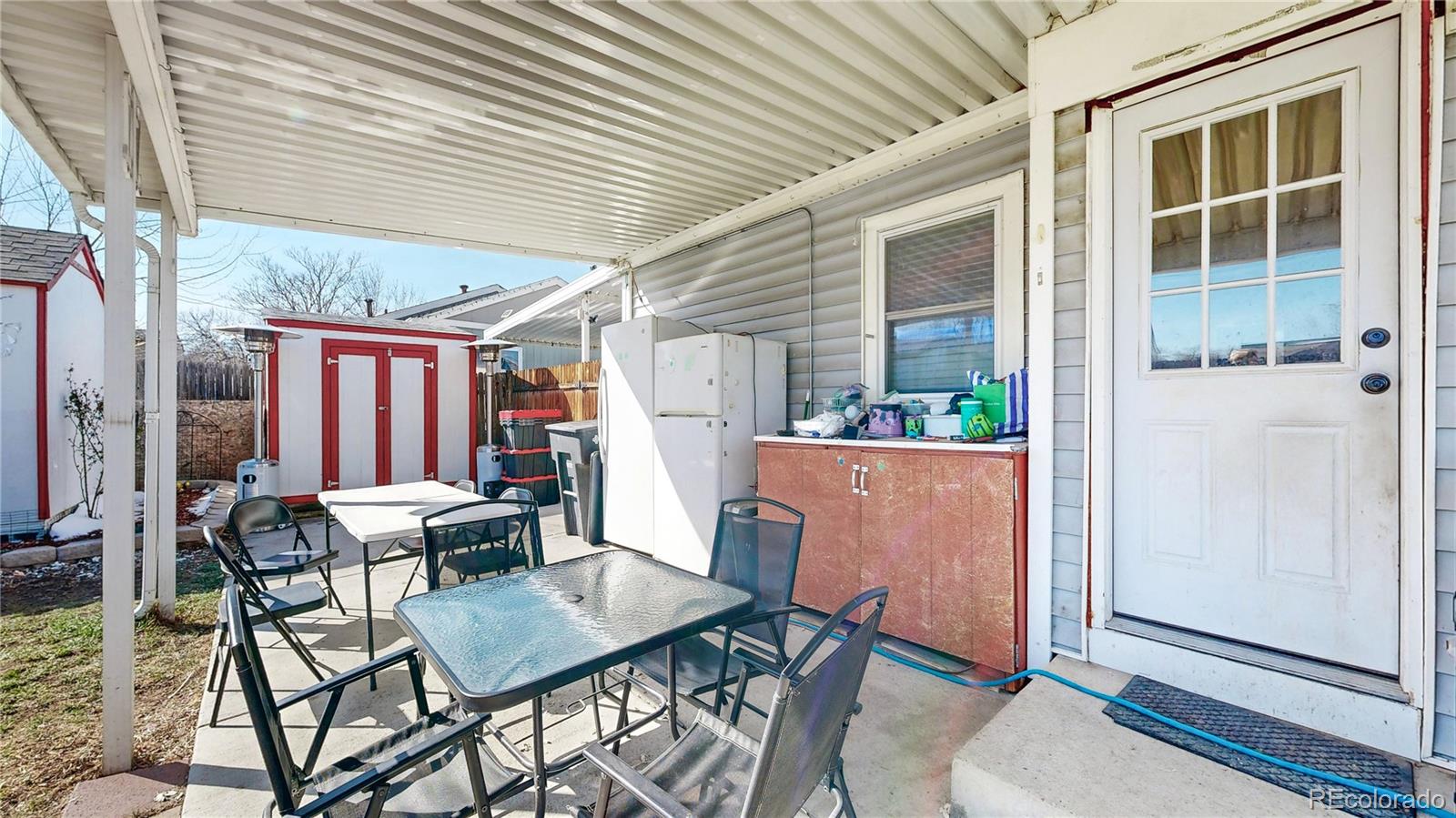 1960 Rowena Street Thornton, CO 80229 - Photo 26 of 48 a outdoor space with a table and chairs
