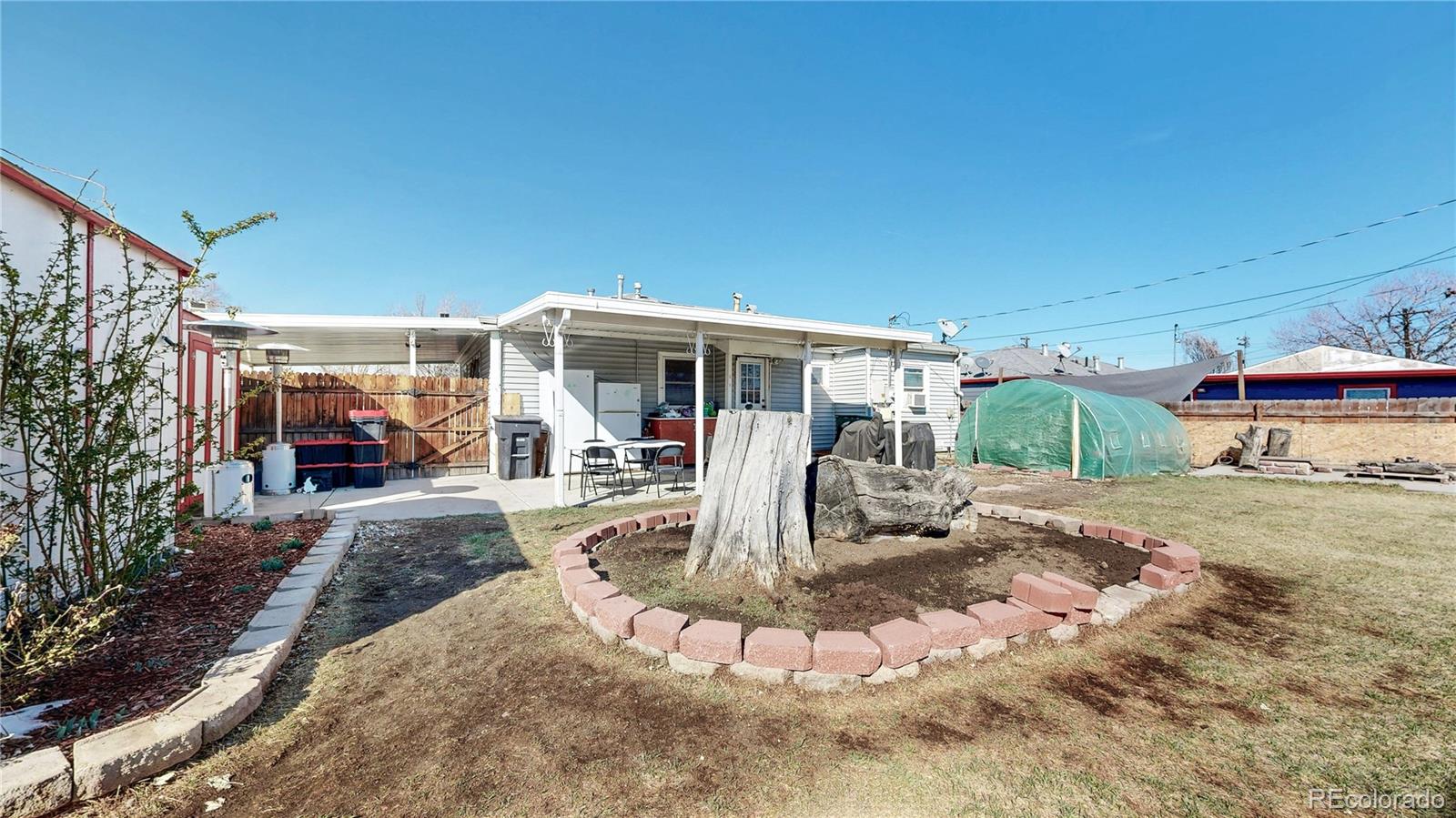 1960 Rowena Street Thornton, CO 80229 - Photo 31 of 48 a view of a house with backyard porch and furniture