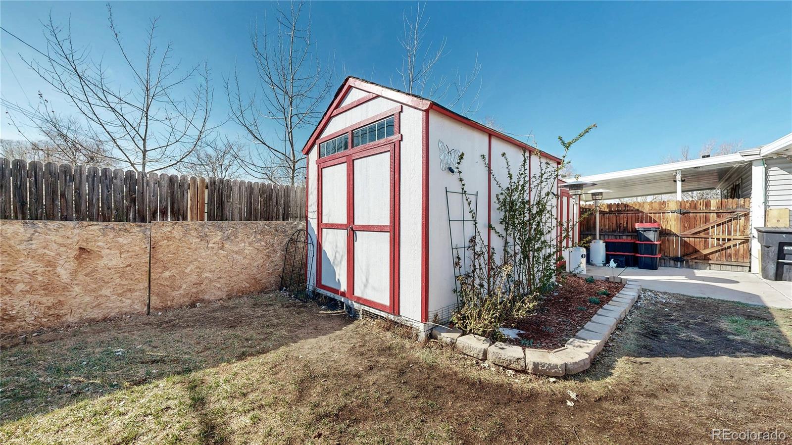 1960 Rowena Street Thornton, CO 80229 - Photo 32 of 48 a view of a house with a backyard