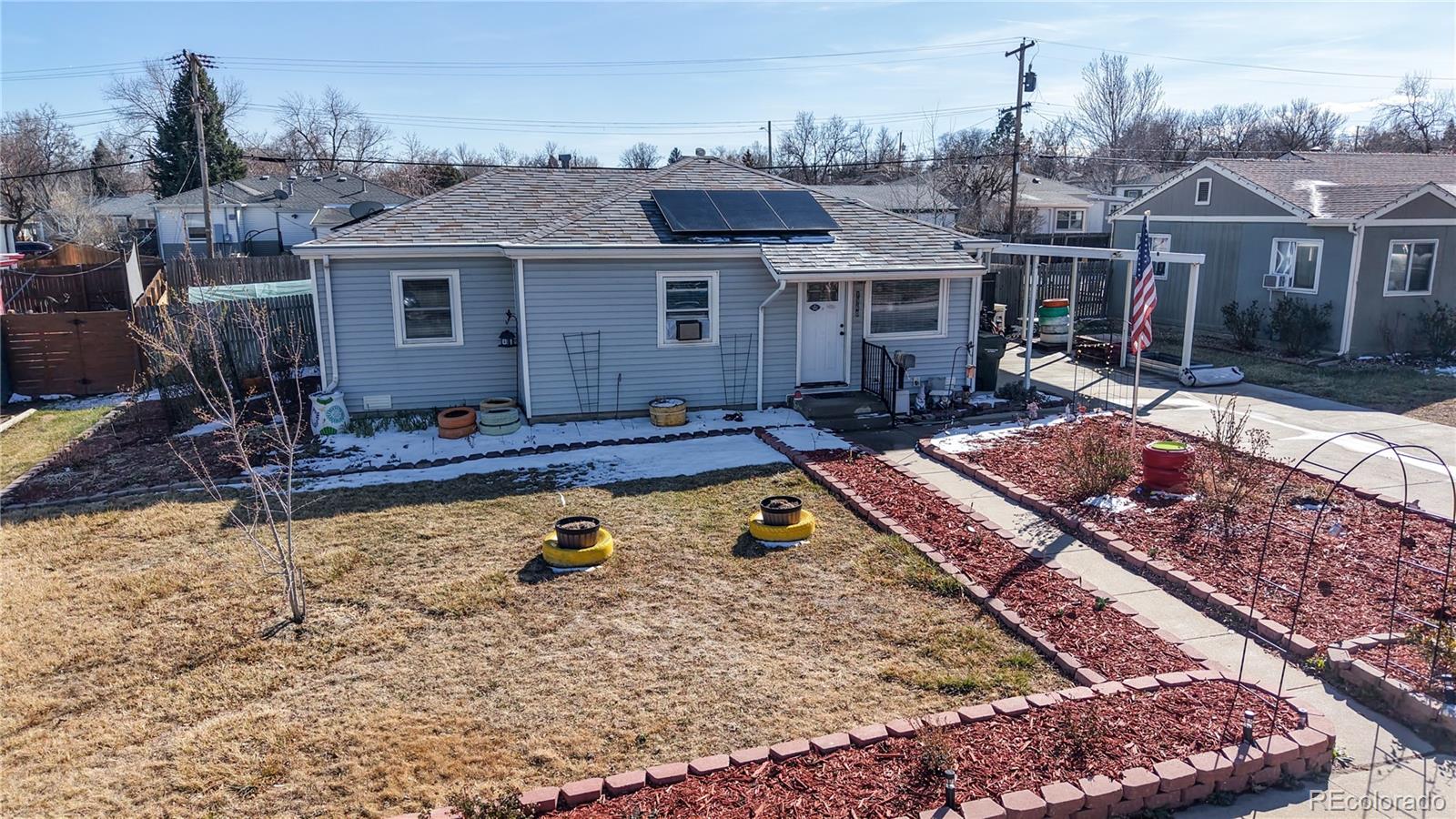 1960 Rowena Street Thornton, CO 80229 - Photo 36 of 48 a view of a house with tub yard and sitting area