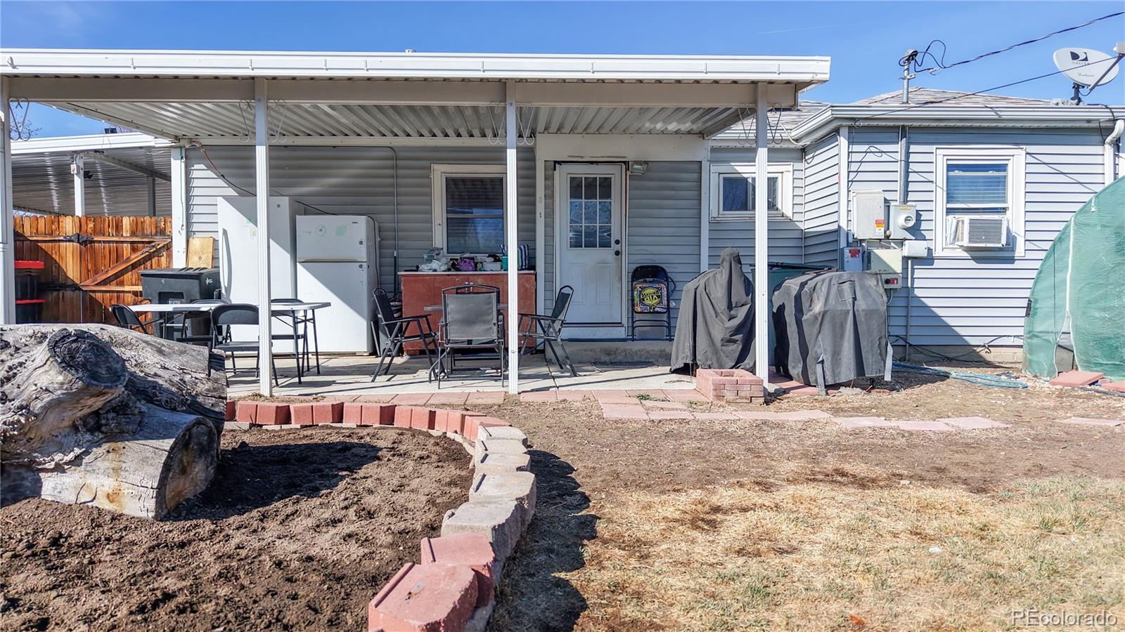 1960 Rowena Street Thornton, CO 80229 - Photo 38 of 48 a view of a lounge chairs in front of house