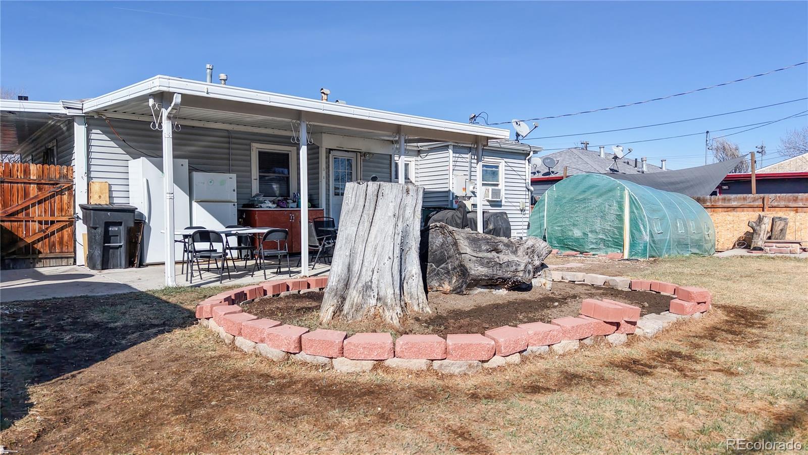 1960 Rowena Street Thornton, CO 80229 - Photo 39 of 48 a view of a house with backyard
