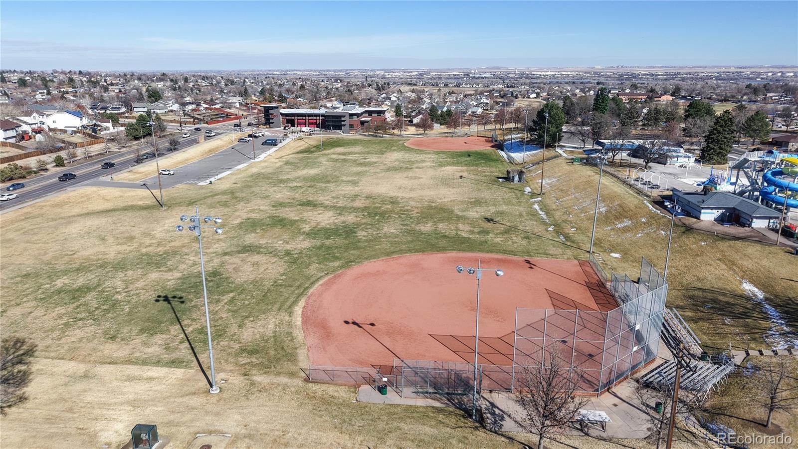 1960 Rowena Street Thornton, CO 80229 - Photo 45 of 48 an aerial view of residential houses with outdoor space