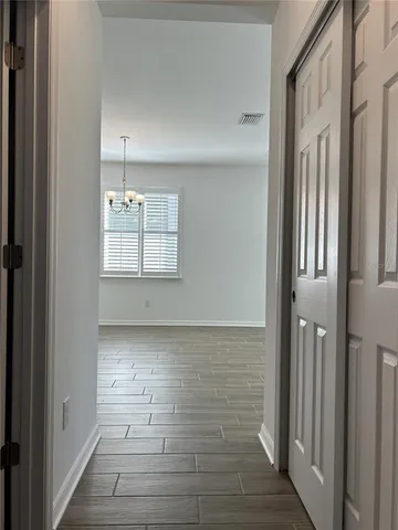 a large kitchen with kitchen island a sink stainless steel appliances and cabinets