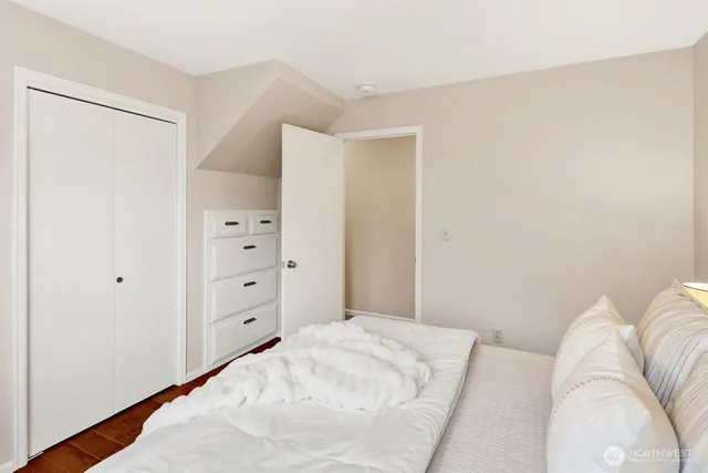 a bedroom with a bed and a dresser