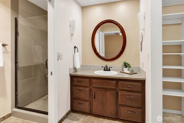 a bathroom with a toilet a sink and a mirror