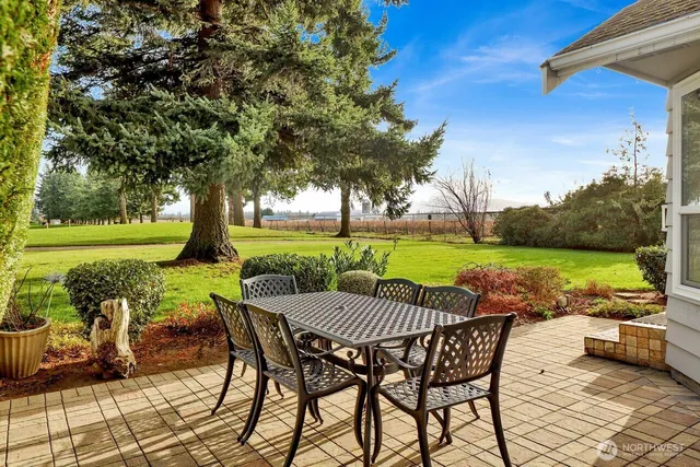 a view of a chairs and table in the patio
