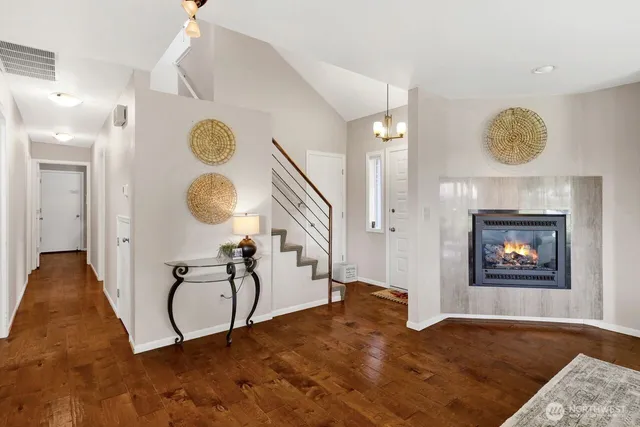 a view of a livingroom with furniture and a mirror