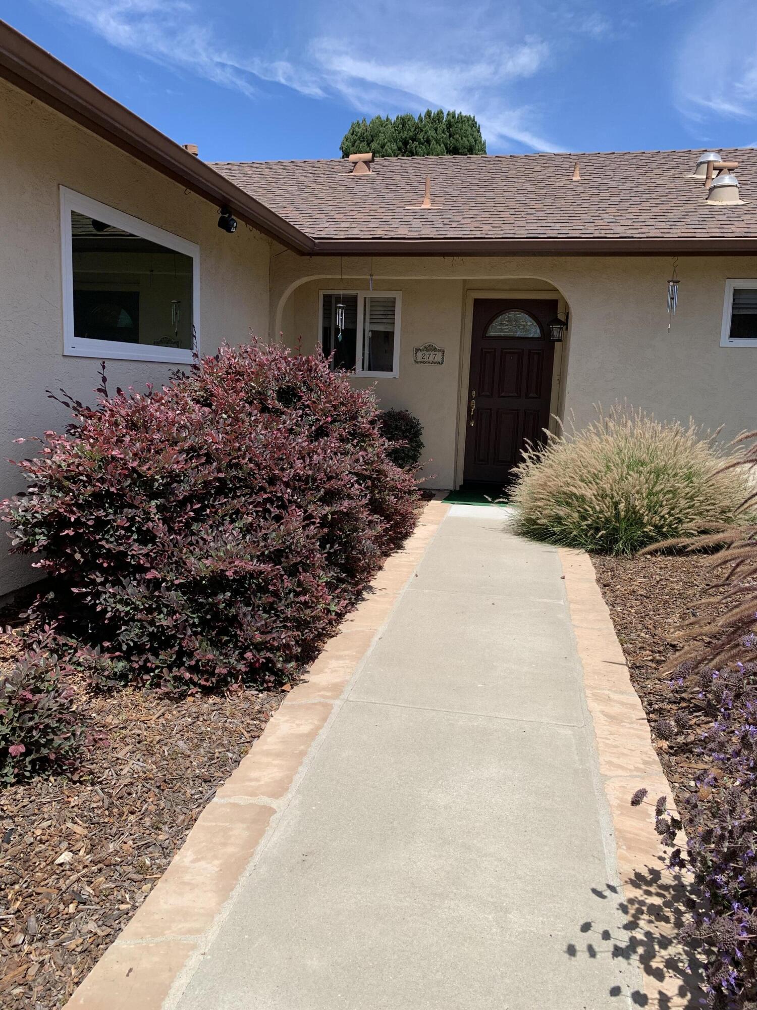 277 Forest Drive Goleta, CA 93117 - Photo 4 of 18 a front view of a house with garden
