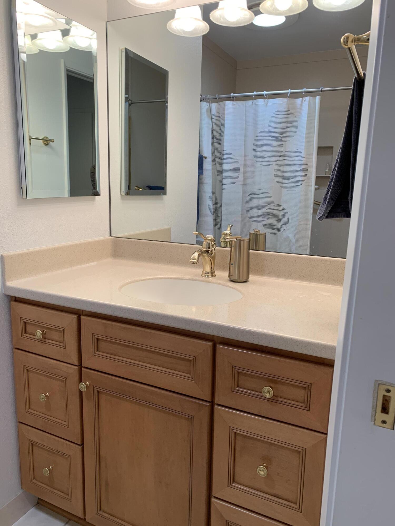 277 Forest Drive Goleta, CA 93117 - Photo 9 of 18 a bathroom with a sink and a mirror