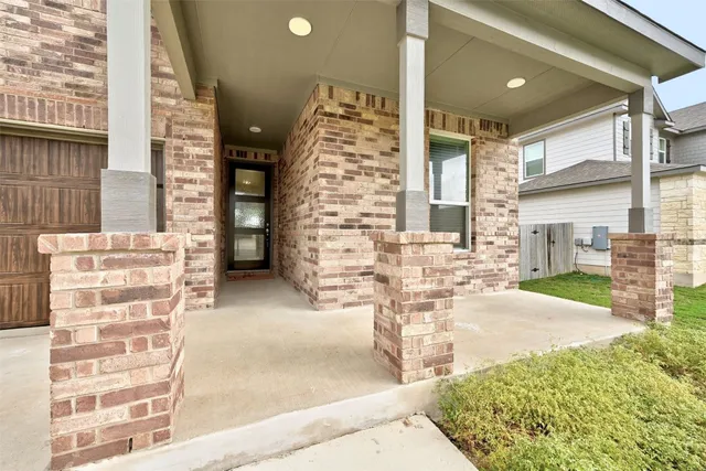 a view of front door of house with outdoor space