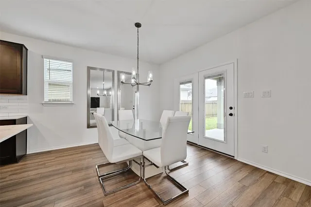 a view of a livingroom with furniture and wooden floor